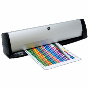X-Rite i1iSis 2 XL spectrophotometer measuring tabloid test charts for ISO-compliant color management