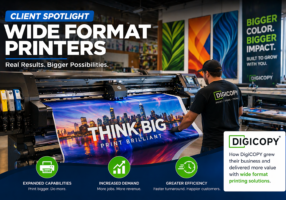 Wide Format Printers Client Spotlight showing DigiCOPY operator running a large format printer producing vibrant signage in a professional print shop