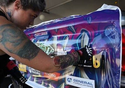 Jasmine of Rabbit Wrapz installing General Formulations 830 vehicle wrap vinyl